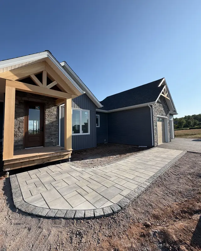 Built by Aderz: Entry walkway with a curved charcoal border (New Glasgow)